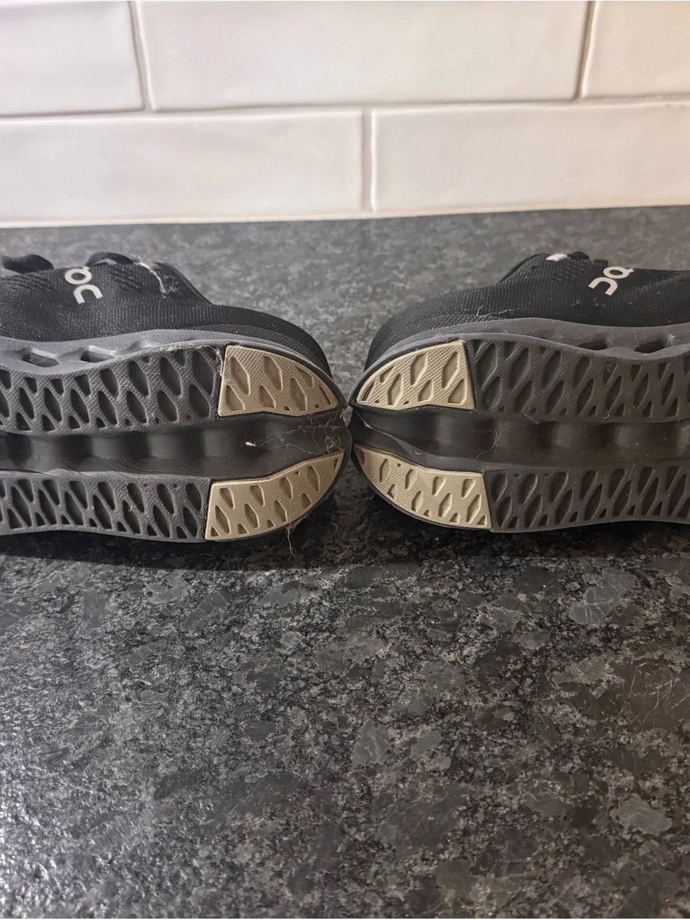 On Running Women’s Black Athletic Lace-Up Running Shoes with Subtle Pink Accents